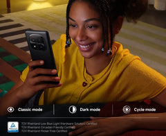 Woman using Xiaomi Redmi Note 14 Pro Plus 5G global version smartphone at home showing rear camera Woman using Xiaomi Redmi Note 14 Pro Plus 5G global version smartphone at home showing rear camera