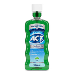 Green 18 fl oz bottle of ACT Anticavity Fluoride Rinse mint flavor zero alcohol mouthwash Green 18 fl oz bottle of ACT Anticavity Fluoride Rinse mint flavor zero alcohol mouthwash