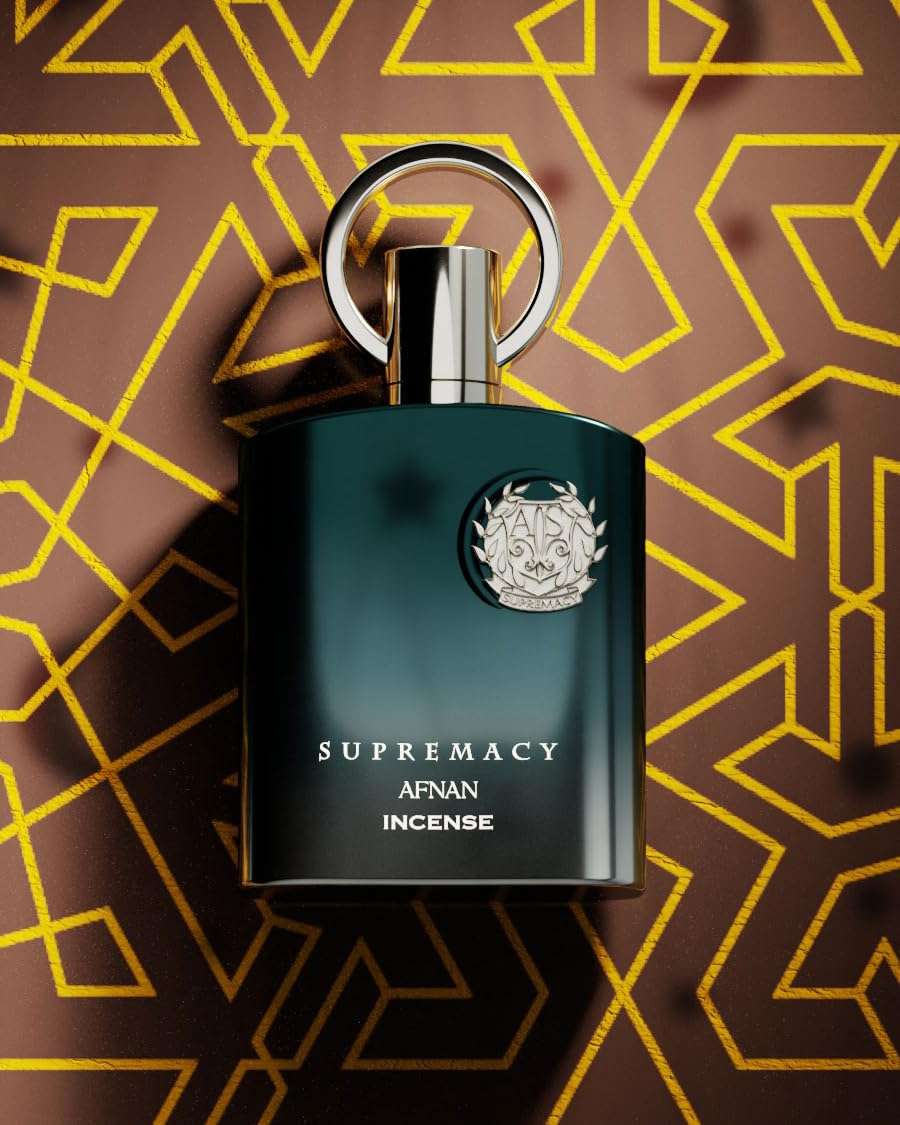 Supremacy Afnan Incense unisex luxury eau de parfum 100ml bottle with black and silver design on geometric background Supremacy Afnan Incense unisex luxury eau de parfum 100ml bottle with black and silver design on geometric background