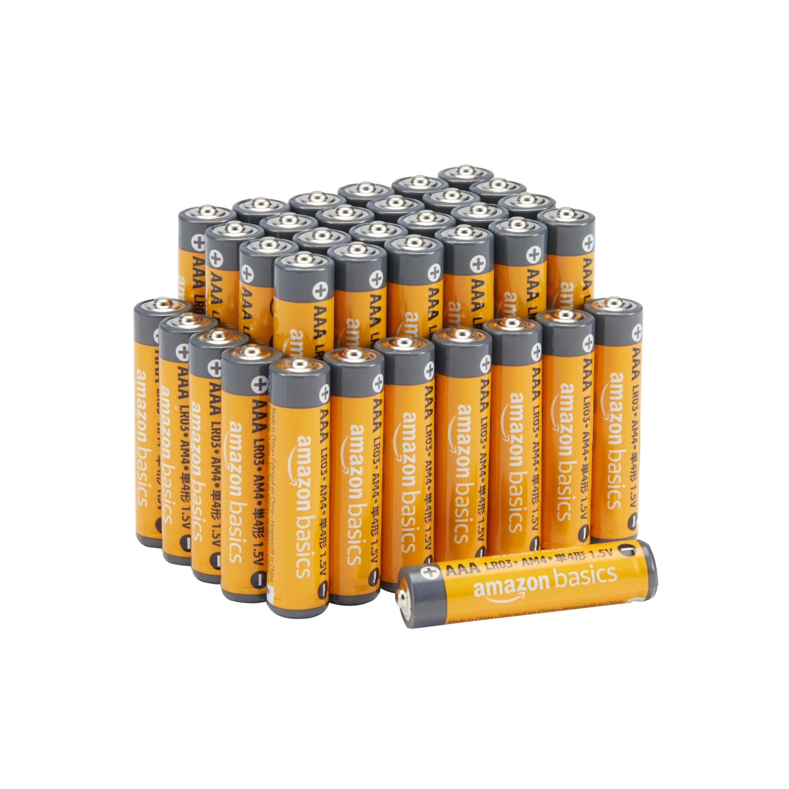 Amazon Basics AAA alkaline batteries 36 pack arranged in rows with one battery lying flat Amazon Basics AAA alkaline batteries 36 pack arranged in rows with one battery lying flat