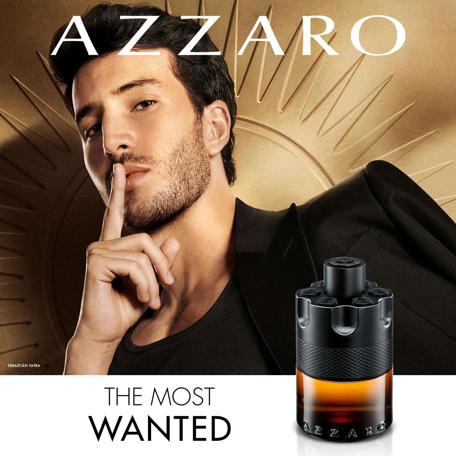 Azzaro The Most Wanted Parfum for men with a stylish man posing in black outfit and golden background Azzaro The Most Wanted Parfum for men with a stylish man posing in black outfit and golden background