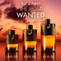 Azzaro The Most Wanted Parfum for men in three bottle sizes against a sunset background Azzaro The Most Wanted Parfum for men in three bottle sizes against a sunset background