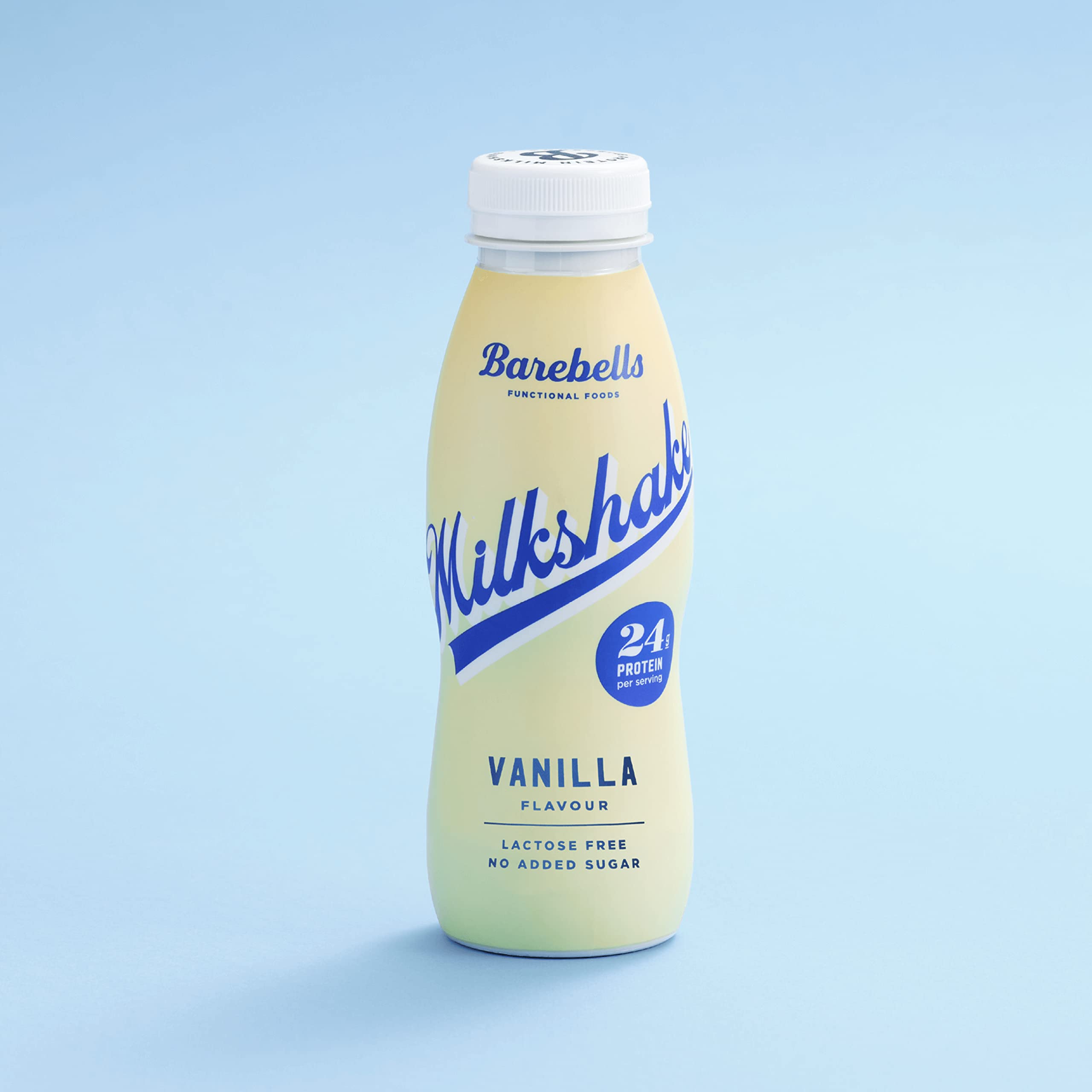 Bottle of Barebells protein milkshake vanilla on light blue background showing 24g protein label lactose free Bottle of Barebells protein milkshake vanilla on light blue background showing 24g protein label lactose free
