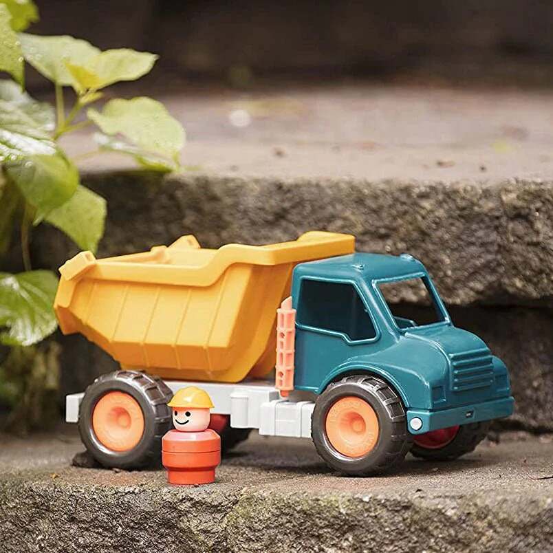 Battat dump truck toy for kids in yellow and teal with a small orange construction worker figure Battat dump truck toy for kids in yellow and teal with a small orange construction worker figure