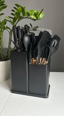 Huitich black silicone kitchen utensils set with knife in a black stand on white table Huitich black silicone kitchen utensils set with knife in a black stand on white table