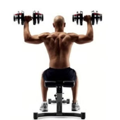 Man exercising with Huitich 24kg adjustable dumbbell set seated on bench for strength training Man exercising with Huitich 24kg adjustable dumbbell set seated on bench for strength training