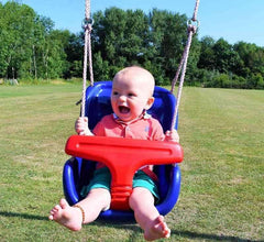 Happy baby enjoying a comfortable baby swing for home in a blue and red Huitich swing chair outdoors Happy baby enjoying a comfortable baby swing for home in a blue and red Huitich swing chair outdoors