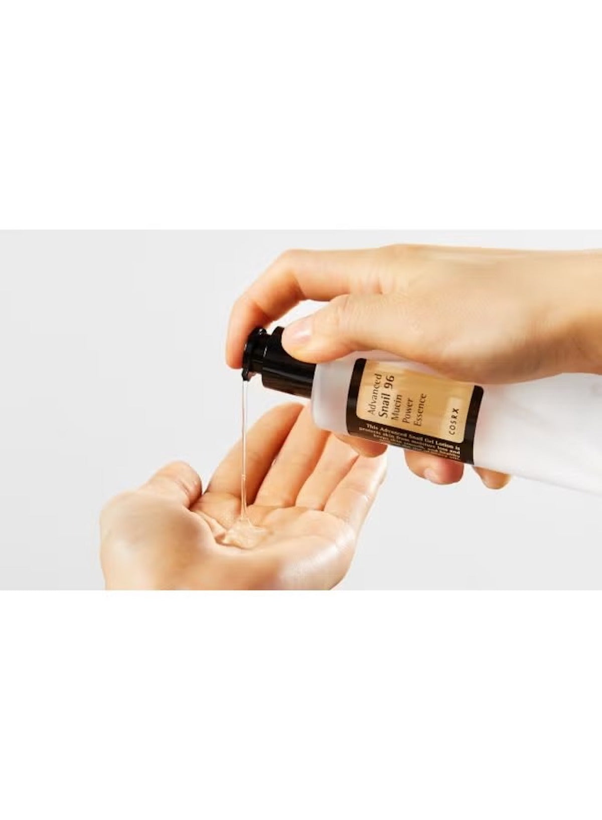 COSRX Advanced Snail 96 Mucin Power Essence being applied to hand for skincare benefits COSRX Advanced Snail 96 Mucin Power Essence being applied to hand for skincare benefits