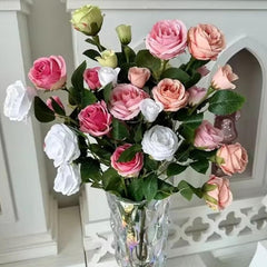 Huitich artificial flowers featuring colorful fake roses for home decoration in a clear glass vase Huitich artificial flowers featuring colorful fake roses for home decoration in a clear glass vase