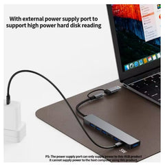Huitich dual interface USB hub for laptop with external power supply port connected to laptop and power adapter Huitich dual interface USB hub for laptop with external power supply port connected to laptop and power adapter