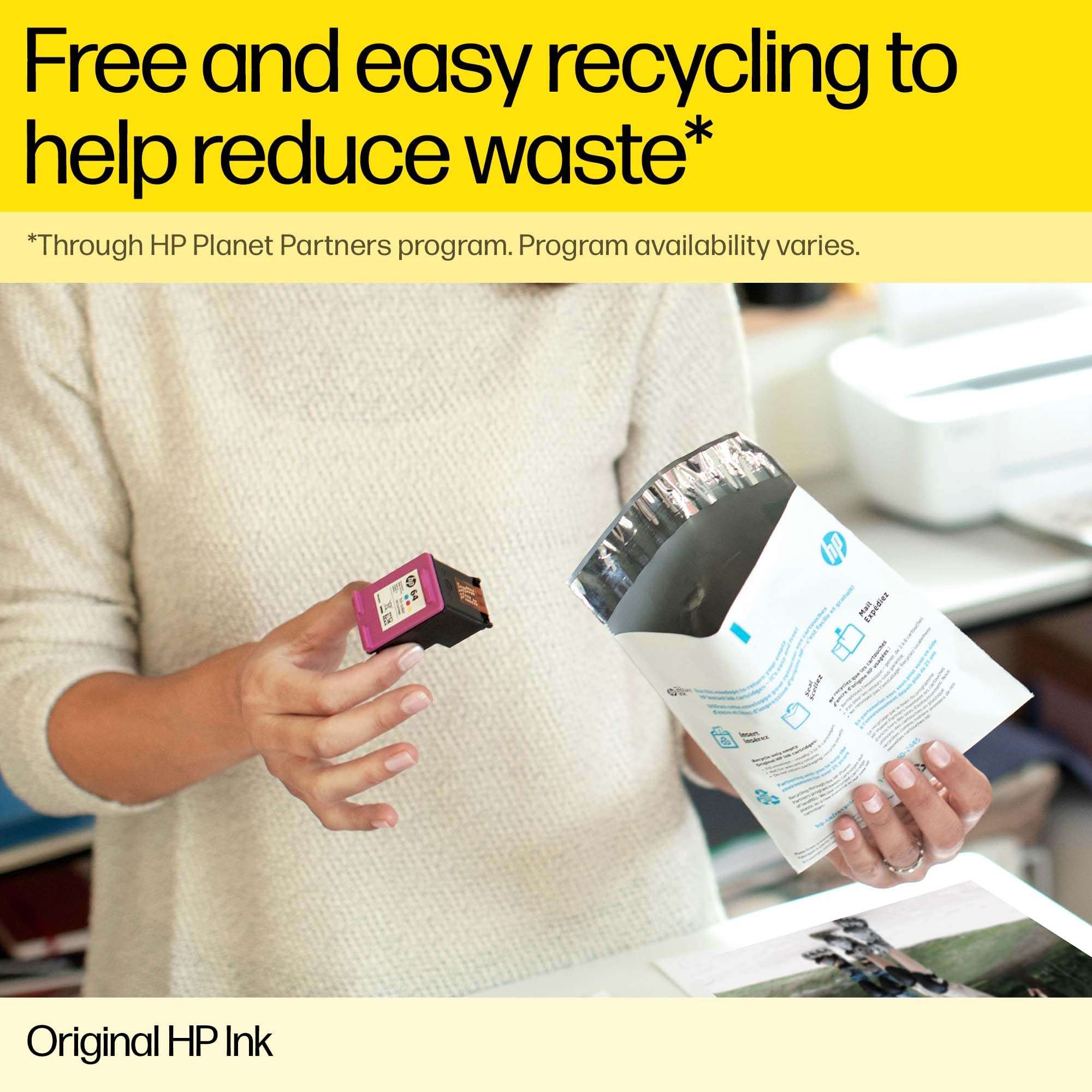 Person holding original HP ink for DeskJet printers with recycling mail-back envelope Person holding original HP ink for DeskJet printers with recycling mail-back envelope