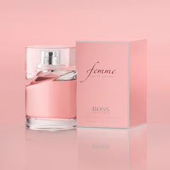 Hugo Boss Femme perfume bottle and pink packaging by Mumzar on pink background Hugo Boss Femme perfume bottle and pink packaging by Mumzar on pink background