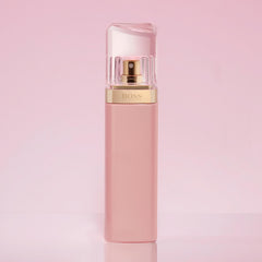 Hugo Boss Ma Vie for women perfume bottle with pink and gold design on pink background Hugo Boss Ma Vie for women perfume bottle with pink and gold design on pink background