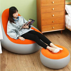 Huitich inflatable orange lounge chair with matching ottoman featuring a woman reading comfortably Huitich inflatable orange lounge chair with matching ottoman featuring a woman reading comfortably