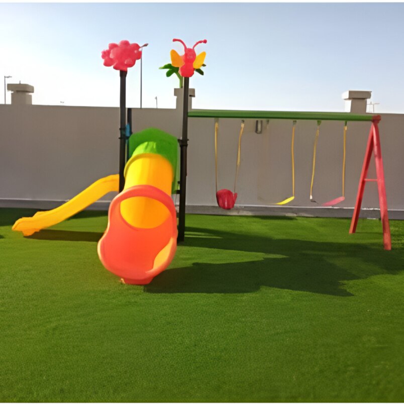 Huitich kids outdoor playset with swings and slide on a green artificial lawn Huitich kids outdoor playset with swings and slide on a green artificial lawn