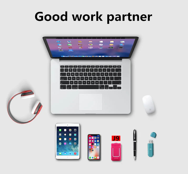 Mumzar mini flip phone bluetooth J9 pink beside laptop tablet smartphone headphones pen and USB drive Mumzar mini flip phone bluetooth J9 pink beside laptop tablet smartphone headphones pen and USB drive