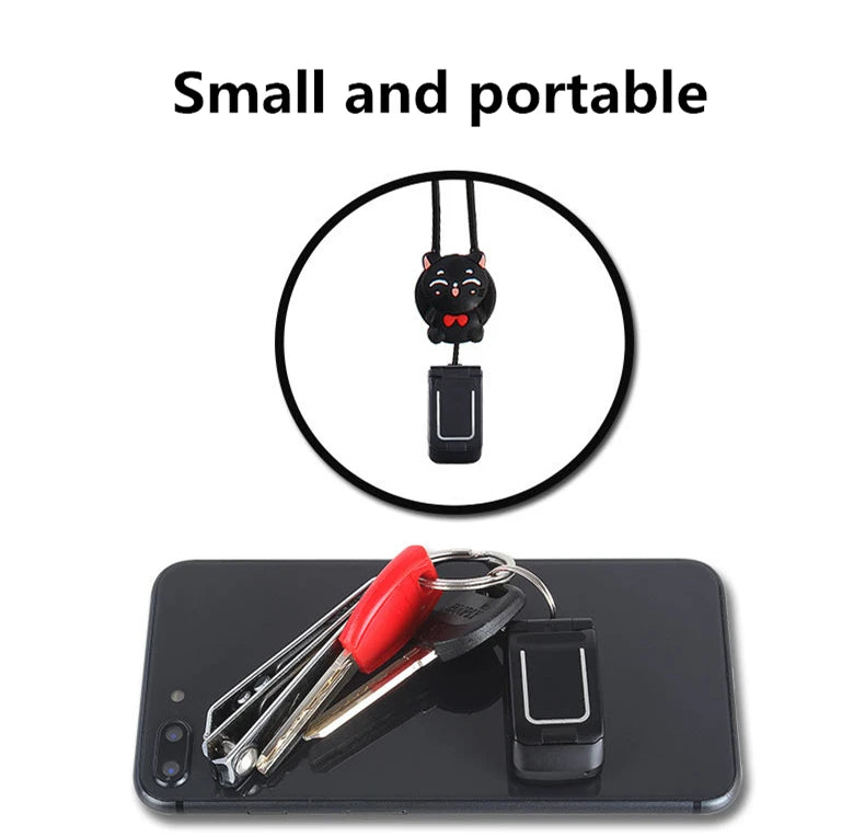 Mumzar mini flip phone bluetooth keychain in black shown with keys on a smartphone for portability Mumzar mini flip phone bluetooth keychain in black shown with keys on a smartphone for portability