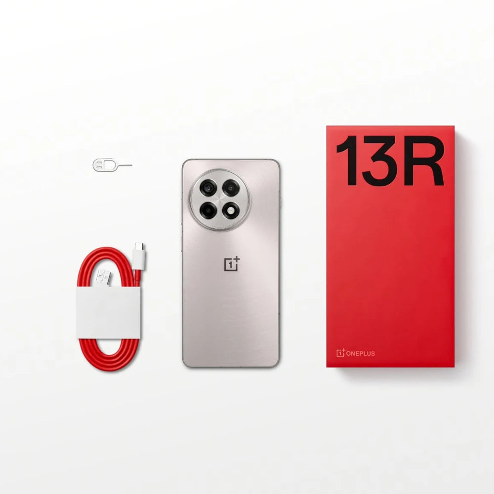 OnePlus 13R global version smartphone with silver back triple camera red charging cable and red 13R box OnePlus 13R global version smartphone with silver back triple camera red charging cable and red 13R box