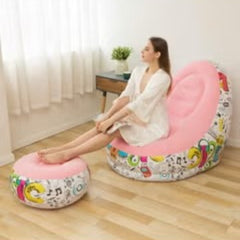 Huitich pink inflatable lounge chair with colorful base and matching footrest used in bright room Huitich pink inflatable lounge chair with colorful base and matching footrest used in bright room
