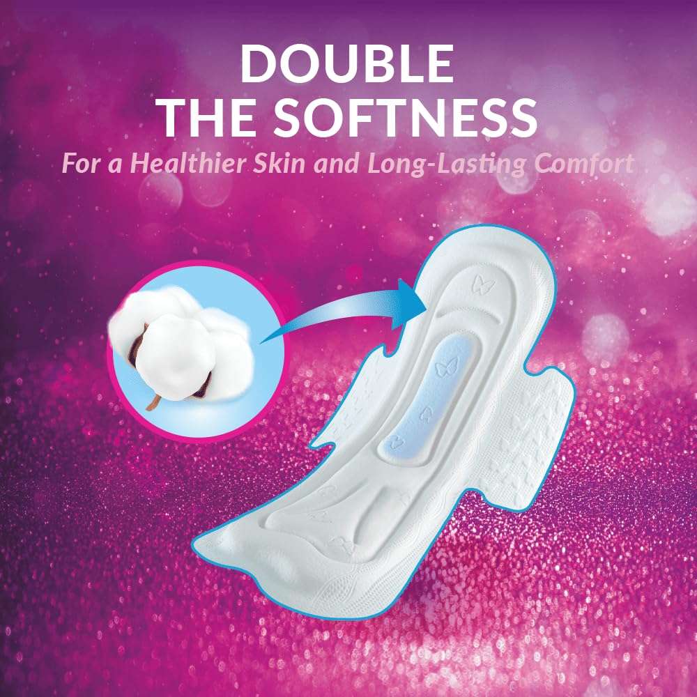 White absorbent sanitary pad with cotton insert and double softness text on pink background maxi night sanitary pads UAE White absorbent sanitary pad with cotton insert and double softness text on pink background maxi night sanitary pads UAE