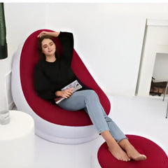 Huitich red inflatable lounge chair with a person relaxing and an ottoman in a modern room Huitich red inflatable lounge chair with a person relaxing and an ottoman in a modern room