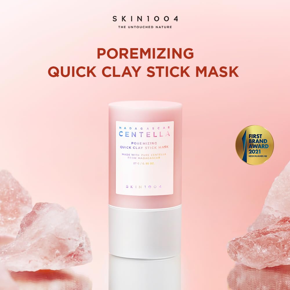 SKIN1004 pore minimizing face mask stick in pink packaging with crystal stones on a pink background SKIN1004 pore minimizing face mask stick in pink packaging with crystal stones on a pink background