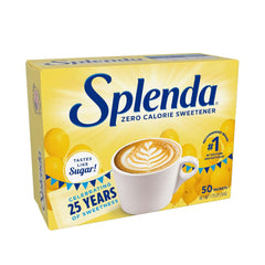 Box of Splenda no calorie sweetener packets 50 count with yellow packaging and cup of latte art Box of Splenda no calorie sweetener packets 50 count with yellow packaging and cup of latte art