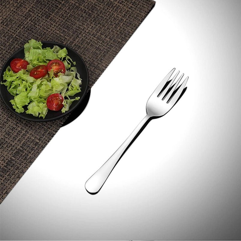 Huitich forks set of 12 for kitchen showing a polished steel fork next to a fresh salad plate Huitich forks set of 12 for kitchen showing a polished steel fork next to a fresh salad plate