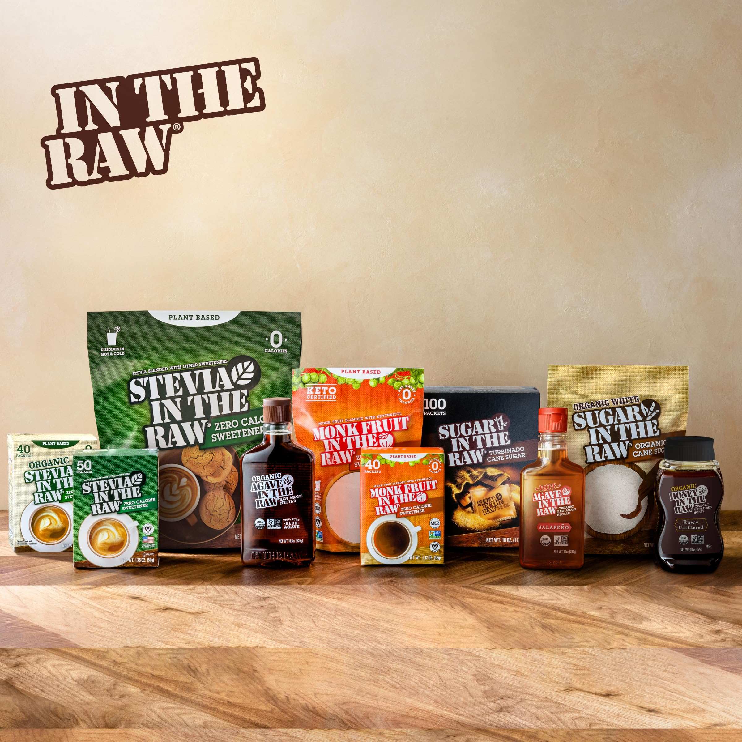 IN THE RAW product lineup on wooden table showcasing packets and bottles including stevia sugar substitute 100 count. IN THE RAW product lineup on wooden table showcasing packets and bottles including stevia sugar substitute 100 count.
