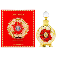 Swiss Arabian Layali Rouge perfume oil with ornate gold and red bottle beside matching decorative box Swiss Arabian Layali Rouge perfume oil with ornate gold and red bottle beside matching decorative box