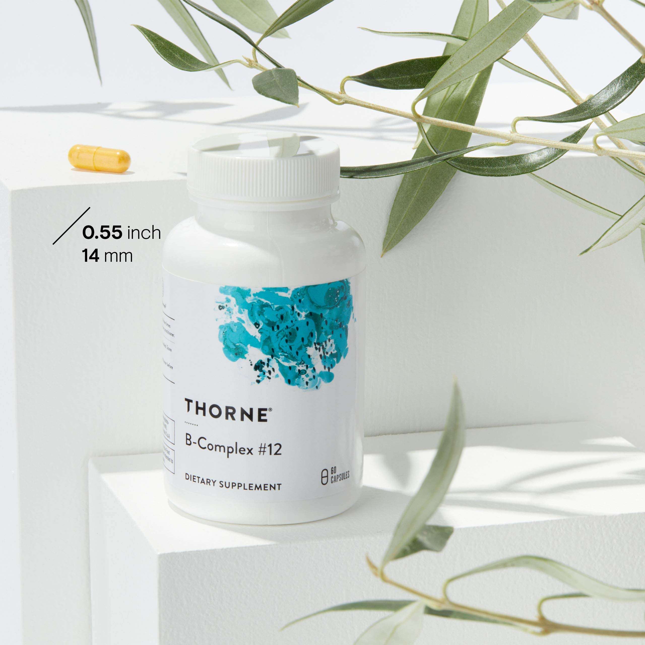 THORNE B Complex supplement bottle with yellow capsule and eucalyptus leaves Vitamin B Complex supplement UAE THORNE B Complex supplement bottle with yellow capsule and eucalyptus leaves Vitamin B Complex supplement UAE