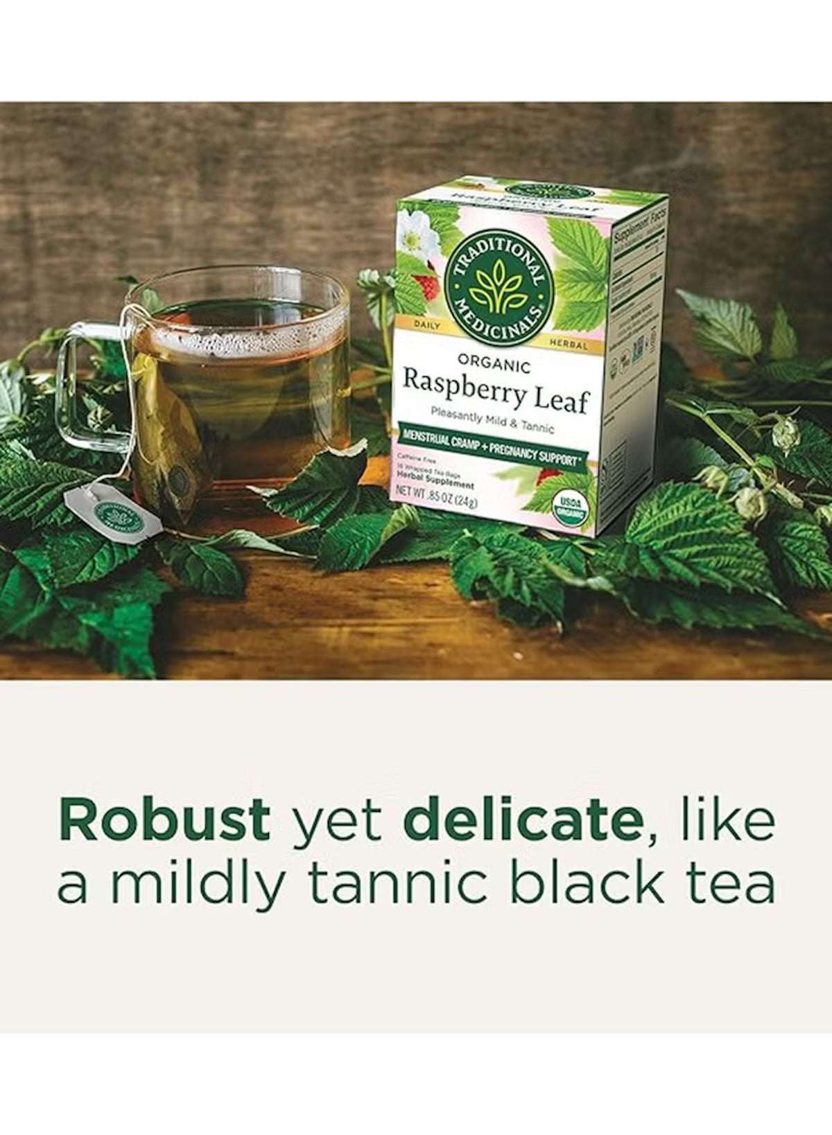 Traditional Medicinals organic raspberry leaf tea brewed in a glass mug with fresh raspberry leaves Traditional Medicinals organic raspberry leaf tea brewed in a glass mug with fresh raspberry leaves