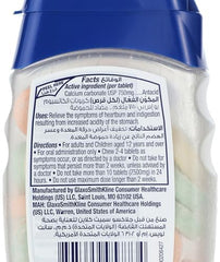 Blue cap bottle of Tums antacid chewable tablets showing nutrition facts label and white chewable tablets Blue cap bottle of Tums antacid chewable tablets showing nutrition facts label and white chewable tablets
