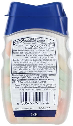 Tums antacid chewable tablets bottle with blue cap showing back label barcode and multicolored tablets Tums antacid chewable tablets bottle with blue cap showing back label barcode and multicolored tablets