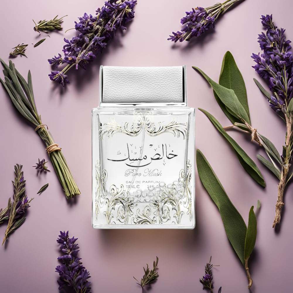 Unisex musk fragrance with deodorant in an elegant clear glass bottle surrounded by lavender and green leaves Unisex musk fragrance with deodorant in an elegant clear glass bottle surrounded by lavender and green leaves