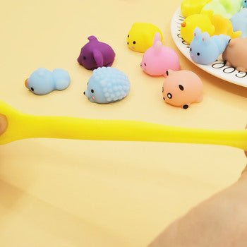 Huitich colorful stress relief squishies for kids in animal shapes including yellow, blue, pink, and purple on a yellow background Huitich colorful stress relief squishies for kids in animal shapes including yellow, blue, pink, and purple on a yellow background