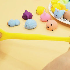 Huitich colorful stress relief squishies for kids in animal shapes including yellow, blue, pink, and purple on a yellow background Huitich colorful stress relief squishies for kids in animal shapes including yellow, blue, pink, and purple on a yellow background