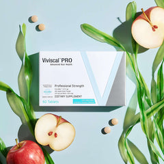 Box of Viviscal PRO hair growth supplements with tablets displayed beside apples and seaweed Box of Viviscal PRO hair growth supplements with tablets displayed beside apples and seaweed
