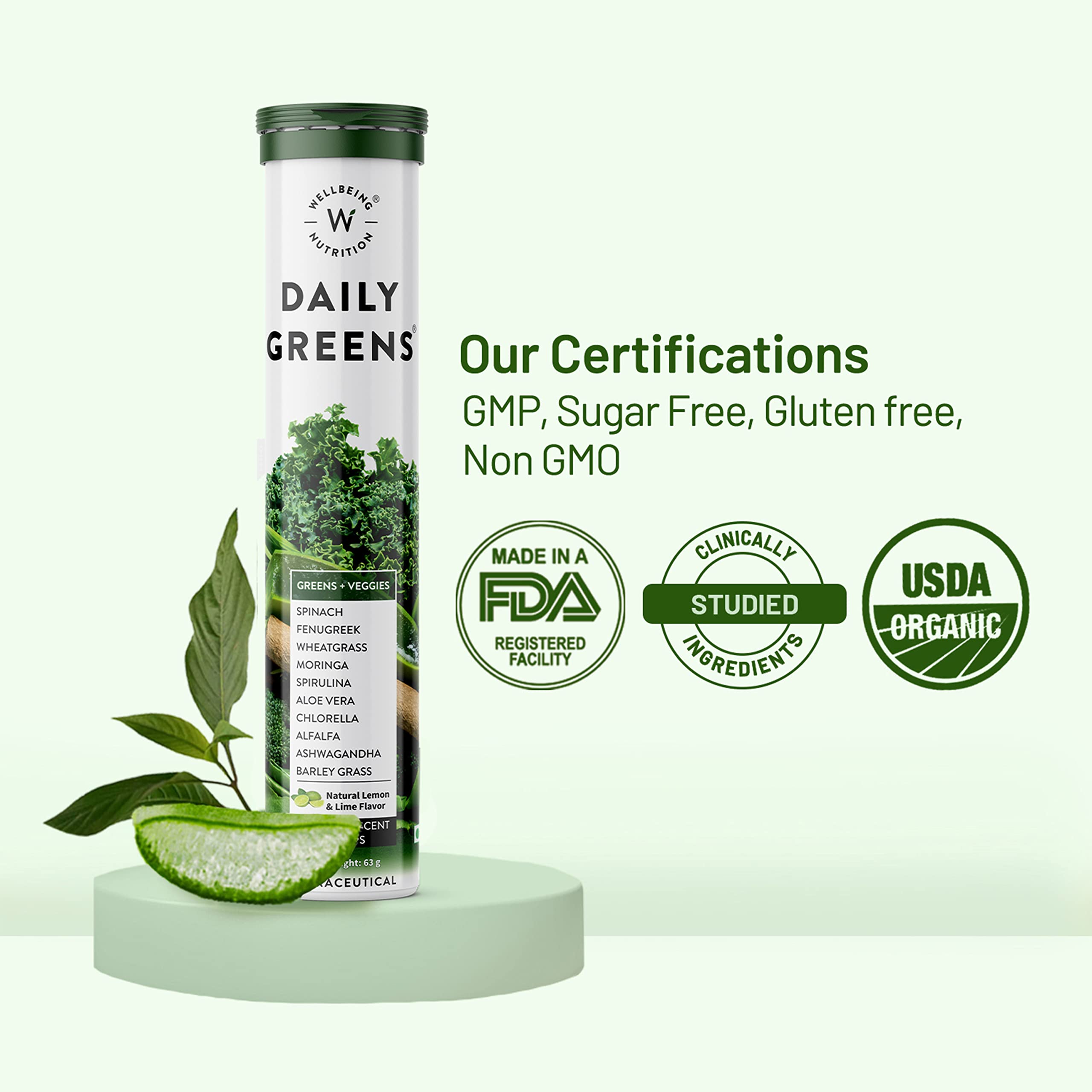 Wellbeing Nutrition Daily Greens tube with kale leaves aloe slice and certification badges wholefood multivitamin with superfoods Wellbeing Nutrition Daily Greens tube with kale leaves aloe slice and certification badges wholefood multivitamin with superfoods