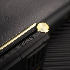 Mumzar dual SIM flip phone for seniors close up showing gold hinge and textured black exterior Mumzar dual SIM flip phone for seniors close up showing gold hinge and textured black exterior