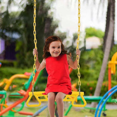 Child swinging on a yellow swing set featuring yellow park gym ring bar for outdoor play Child swinging on a yellow swing set featuring yellow park gym ring bar for outdoor play