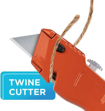 Orange retractable utility knife with extended blade for cutting twine