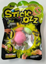 3-pack squishy stress balls in blister pack, including pink and green balls