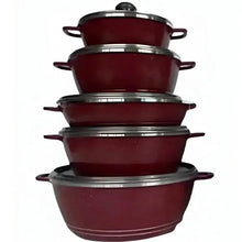 Stacked burgundy cooking pots with glass lids and stainless handles