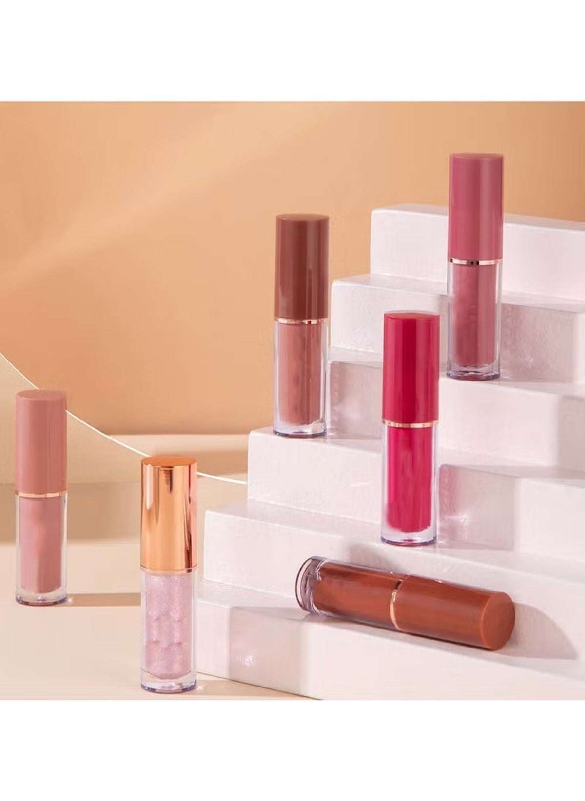 Huitich 12-piece long lasting lip gloss set in various shades displayed on white steps