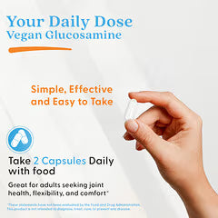 White supplement capsule held between fingers, joint support