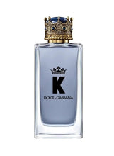 K eau de toilette glass bottle with gold-and-blue crown cap and black K label