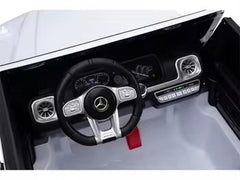Interior view of Mercedes Benz 12V kids ride-on car with remote showing steering wheel and dashboard
