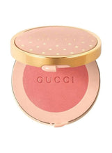 Gucci blush powder compact, bright coral; open lid shows mirror and star pattern