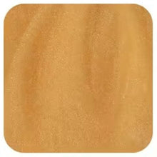 Golden manuka honey surface close-up, smooth textured finish